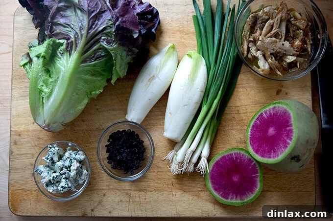 Ingredients on a board for a chopped salad.