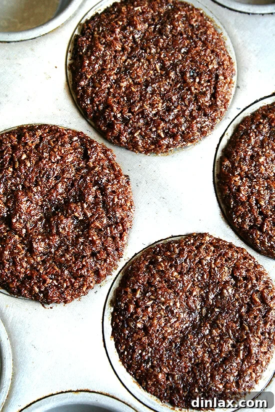 Freshly baked bran muffins, golden and moist An overhead view of freshly baked, golden-brown bran muffins, cooling on a rack.