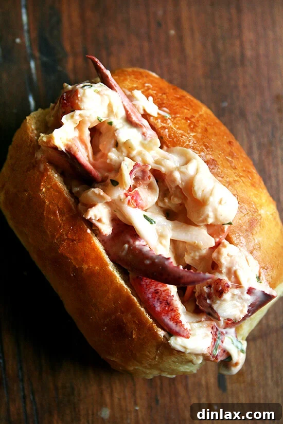 Exquisite homemade lobster rolls featuring fresh lobster meat, homemade tarragon mayonnaise, and a squeeze of lemon, all nestled in toasted buns.