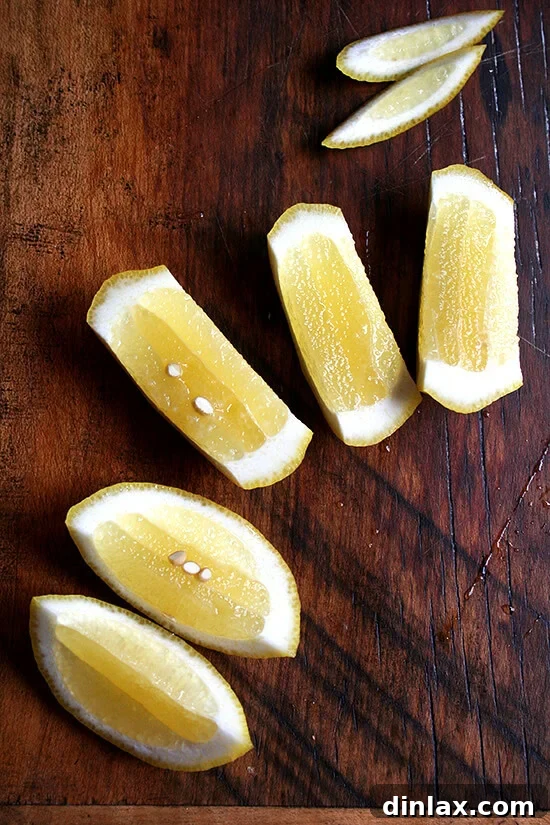 Elegant lemon slices, perfectly cut for garnish, adding a touch of brightness to any meal.