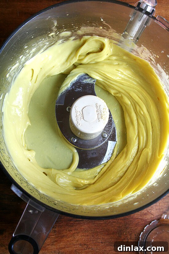 Freshly made homemade mayonnaise, thick and creamy, ready to be flavored.