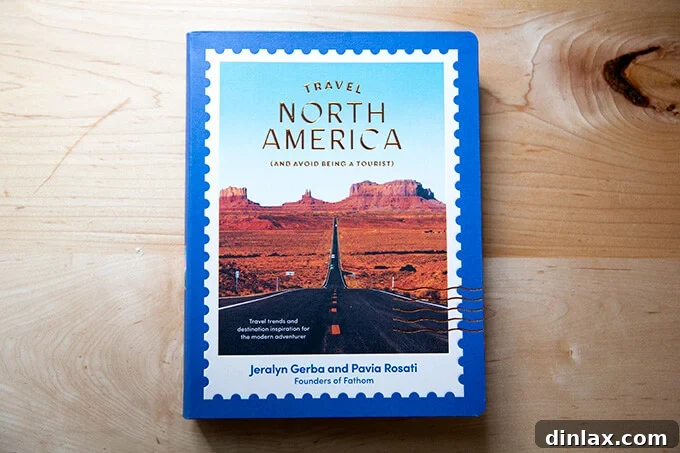 A captivating travel book titled 'Travel North America' resting on a kitchen counter, hinting at adventure.