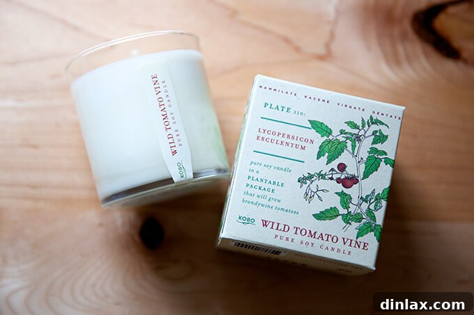 A beautifully designed, tomato-scented candle, evoking the fresh aroma of a garden.