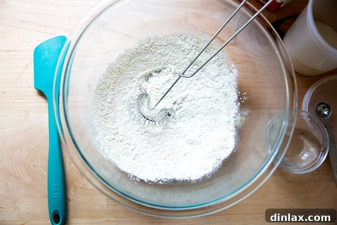 Whisked flour and yeast mixture in a glass bowl.
