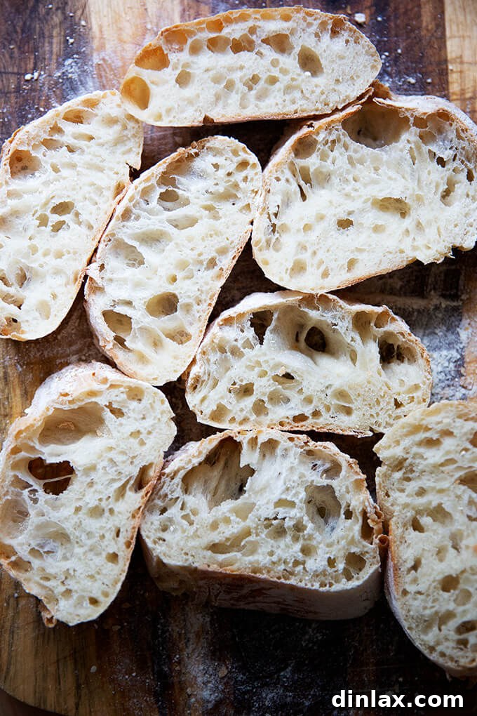 Several slices of ciabatta bread on a countertop, ready to be enjoyed.