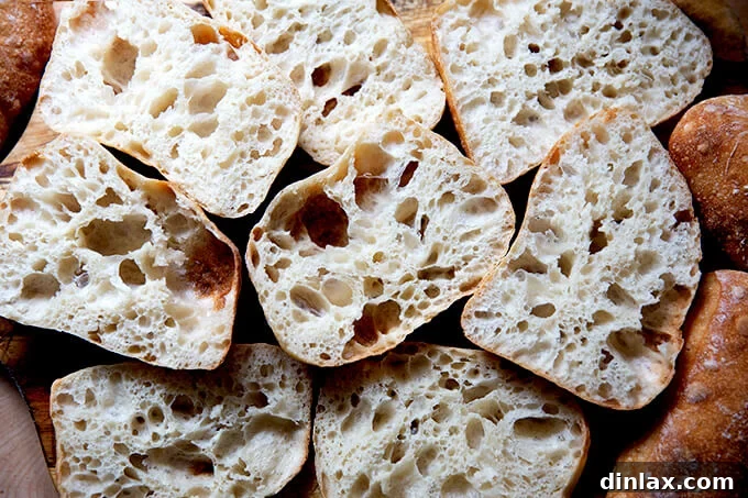 A delicious pile of halved ciabatta rolls, ready for fillings or dipping.