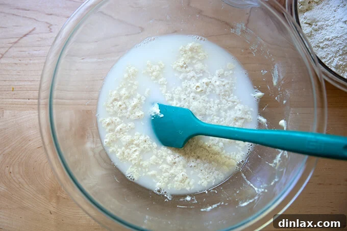 Adding salt to the liquid and poolish mixture.