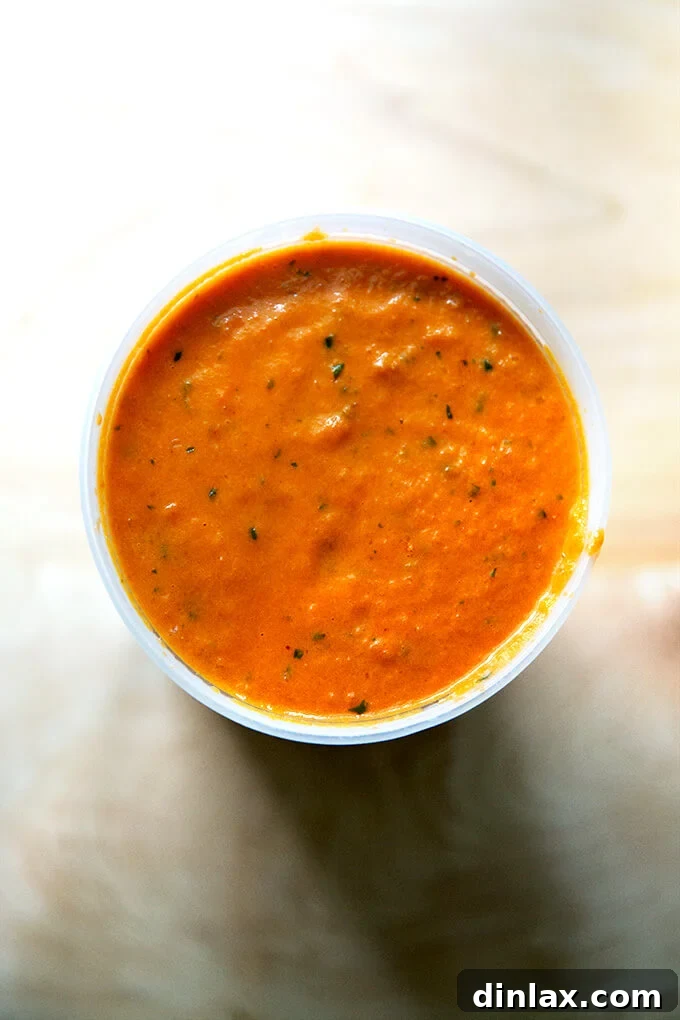 Pantry-Perfect Tomato Sauce in Minutes 14 An overhead shot of homemade vodka sauce in a quart container.