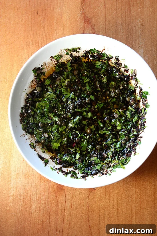 Balsamic-Caper Vinaigrette Ingredients Ingredients for a vibrant balsamic caper vinaigrette, including fresh parsley, capers, shallots, and reduced balsamic vinegar.