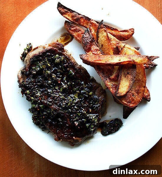 Grilled Grass-fed steak with balsamic caper sauce, perfectly cooked.