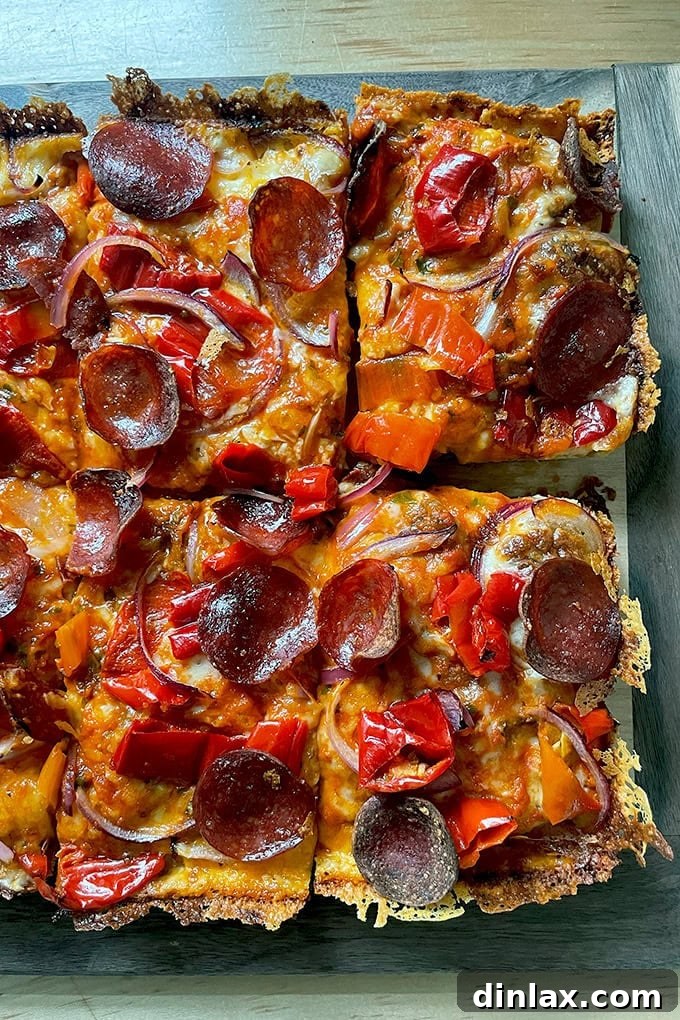 A just-baked Detroit-style pizza on a board.