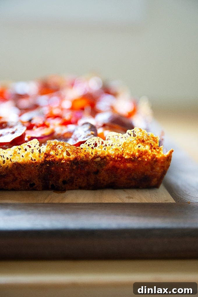 The frico crust of a Detroit-Style pizza.