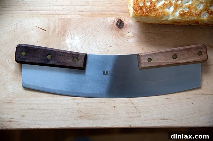 A pizza rocker made by M R Murphy knives.