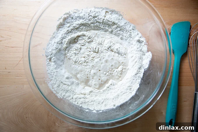 A bowl of flour, water, salt and yeast ready to be mixed into Detroit-style pizza dough.