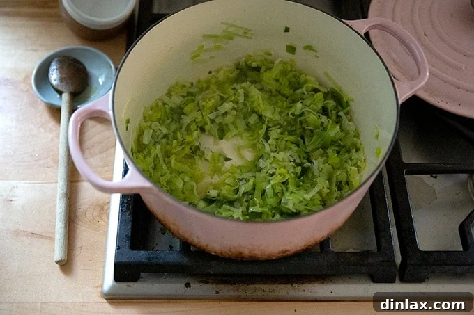 Leeks cooked down and softened in a large soup pot after 10 minutes.