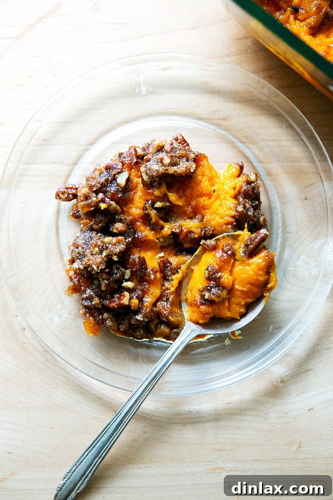 Sweet Potato Comfort Bake 17 A scoop of sweet potato casserole on a plate.