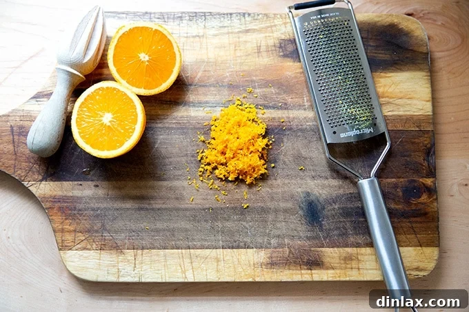 Sweet Potato Comfort Bake 6 Orange zest on a cutting board aside a halved orange.