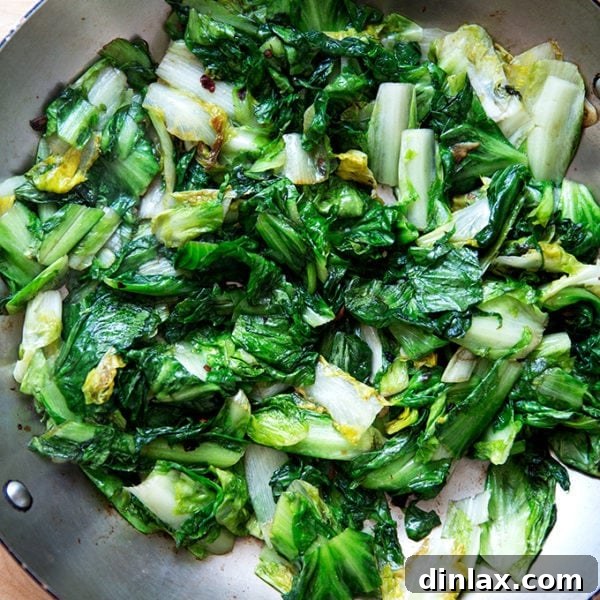 Sautéed escarole in a large skillet.