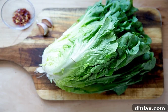 Vibrant Green Sauté 3 A head of escarole on a cutting board.