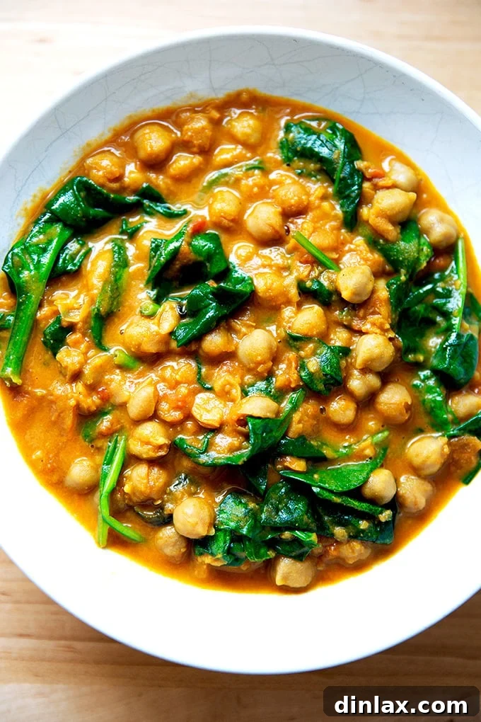 Effortless Butter Chicken and Chickpeas Instant Pot or Stovetop 26 A bowl of creamy Instant Pot butter chickpeas, garnished with fresh herbs, ready for serving.