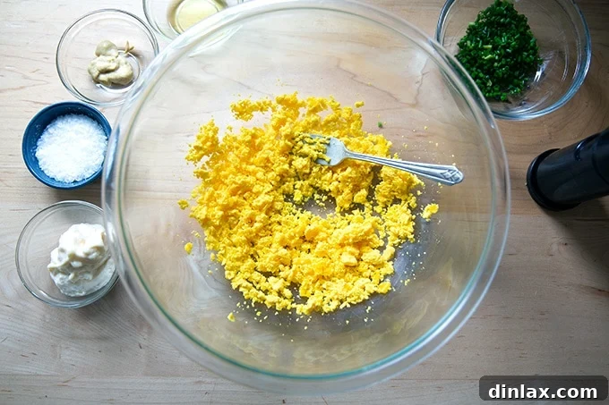 Timeless Deviled Delights 9 A bowl of mashed hard-cooked egg yolks, ready to be mixed with other ingredients.