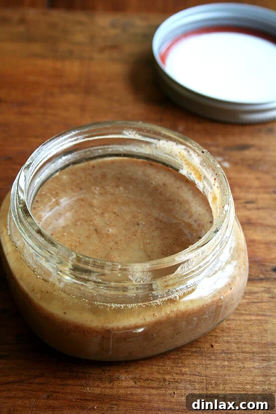 Creamy homemade maple almond butter in a glass jar