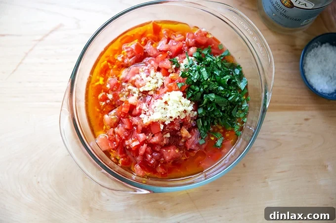 Homemade Trader Joe's Style Bruschetta Sauce 7 A bowl filled with the ingredients to make homemade bruschetta sauce.