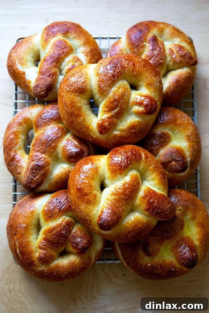 Pillowy Soft Pretzels Made Simple 2 Just-baked soft pretzels on a cooling rack, glistening with butter.
