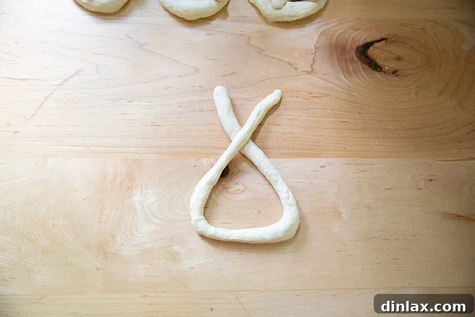 Pillowy Soft Pretzels Made Simple 17 Pretzel dough partly shaped into a pretzel, forming a U-shape.