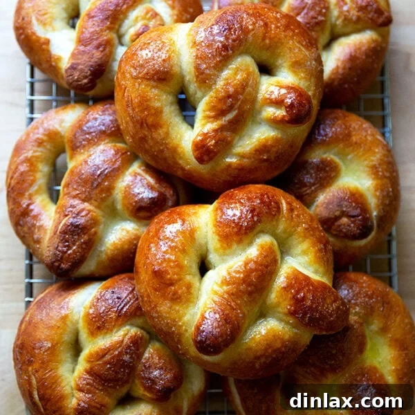 Just-baked soft pretzels on a cooling rack.