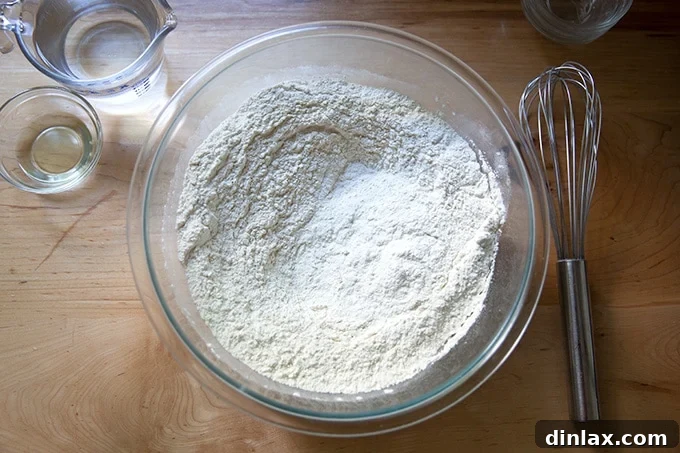 Pillowy Soft Pretzels Made Simple 4 Whisked dry ingredients for soft pretzels in a bowl, showing the uniform mixture.