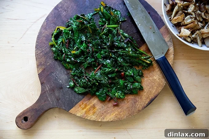 Effortless Butternut Squash Lasagna with Hearty Greens and Mushrooms 9 Finely chopped, tender sautéed Swiss chard ready to be incorporated into the lasagna layers.