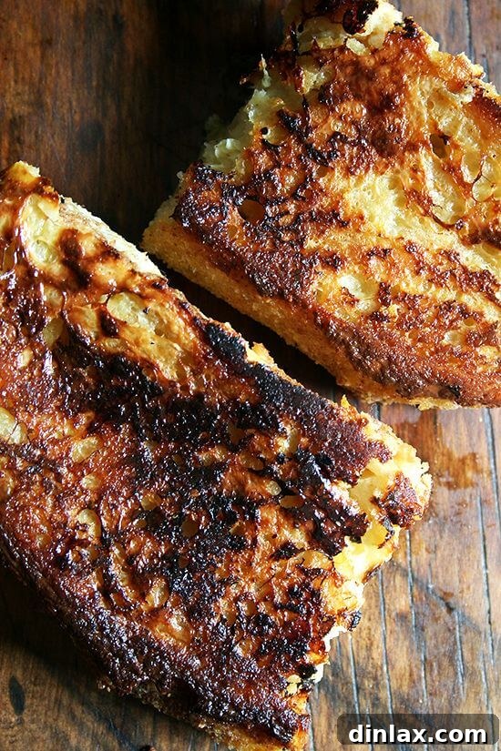 Close-up of baked French toast showing the thick slices of bread, perfectly golden and ready to absorb the rich lemon custard.
