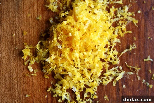 Freshly grated lemon zest, the secret ingredient that adds a bright, unexpected flavor to the French toast custard.