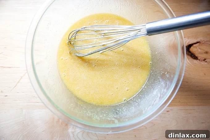 The perfectly whisked mixture of sugar, butter, and eggs, glistening and smooth in the bowl.