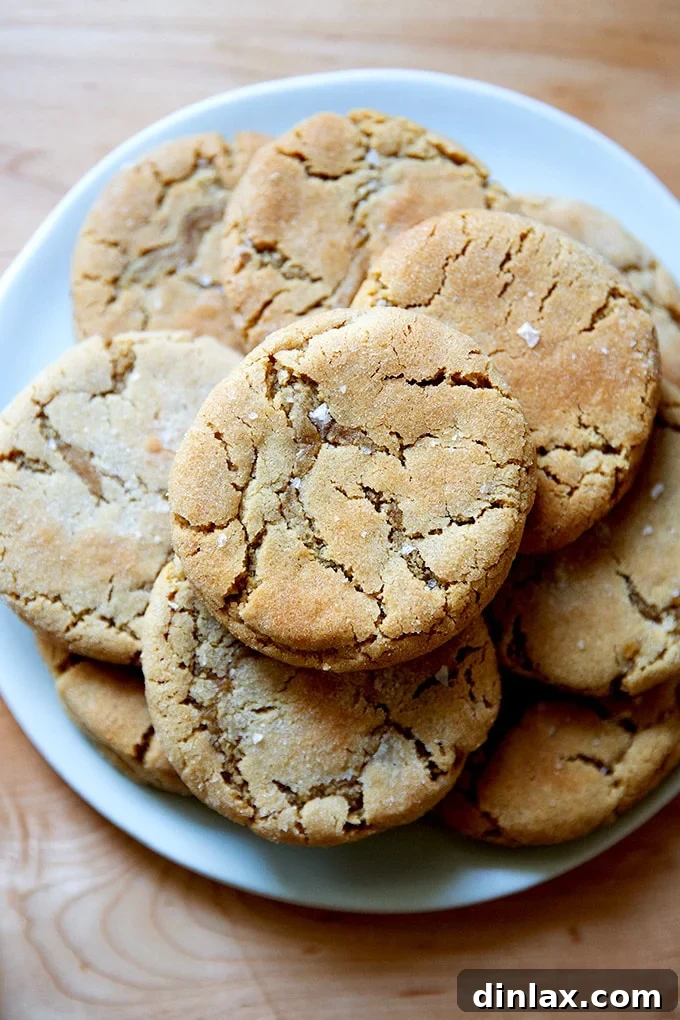 A plate of perfectly baked peanut butter cookies, ready to be enjoyed.