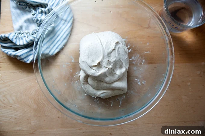 Third stretch and fold after a quarter turn.