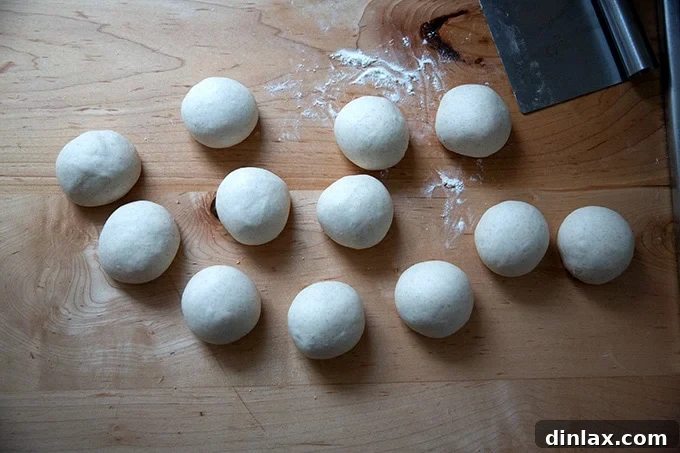 Shaping a dough portion into a taut ball.
