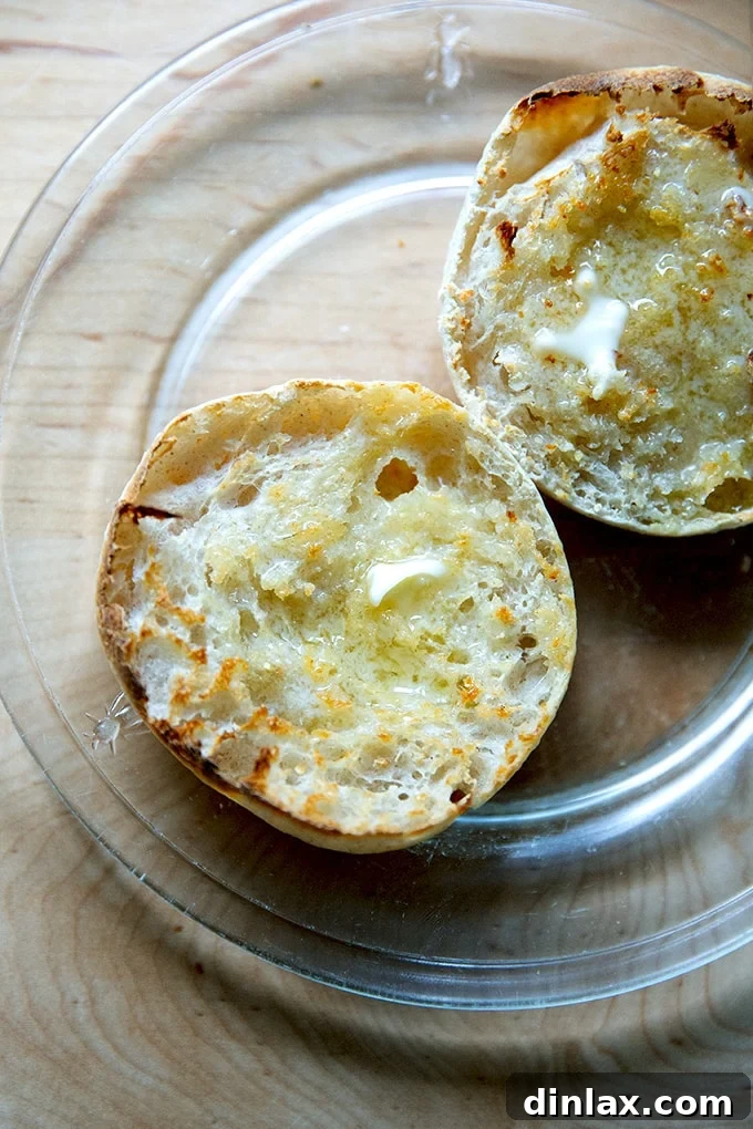 Toasted sourdough English muffin with melted butter.