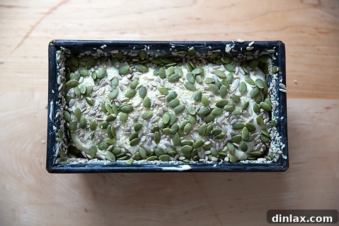 Triple-Seed Stir-and-Bake Loaf 13 The three-seed bread dough gently rising within its loaf pan, showing good volume development.
