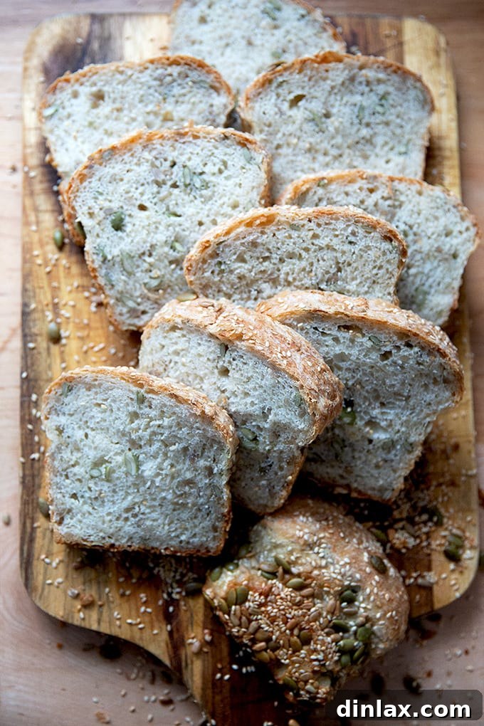 Triple-Seed Stir-and-Bake Loaf 20 Multiple slices of three-seed bread arranged neatly on a cutting board, highlighting the visible seeds.