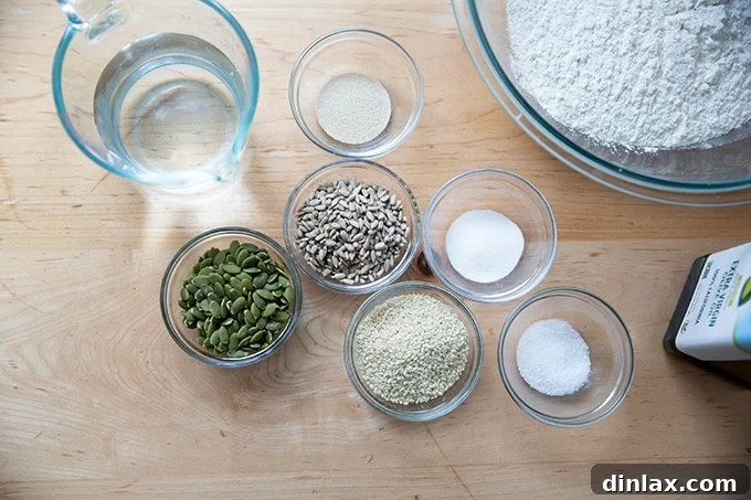 Triple-Seed Stir-and-Bake Loaf 3 All the essential ingredients for baking three-seed bread laid out on a kitchen counter, ready for mixing.
