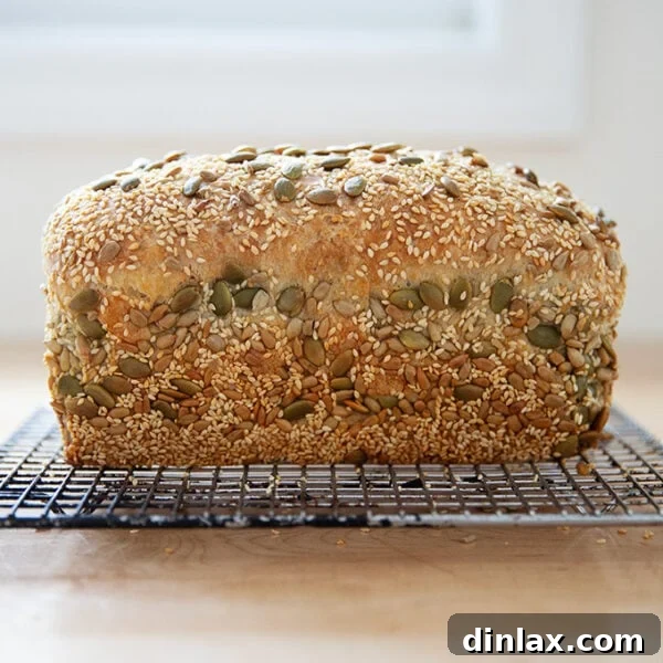 Just-baked three seed bread on a cooling rack.