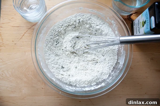 Triple-Seed Stir-and-Bake Loaf 5 The dry ingredients for three-seed bread, meticulously whisked together in a bowl, awaiting the wet components.