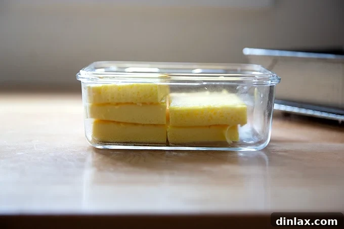 Flour Bakery's Golden Eggwich 15 Egg slices in a glass storage container.
