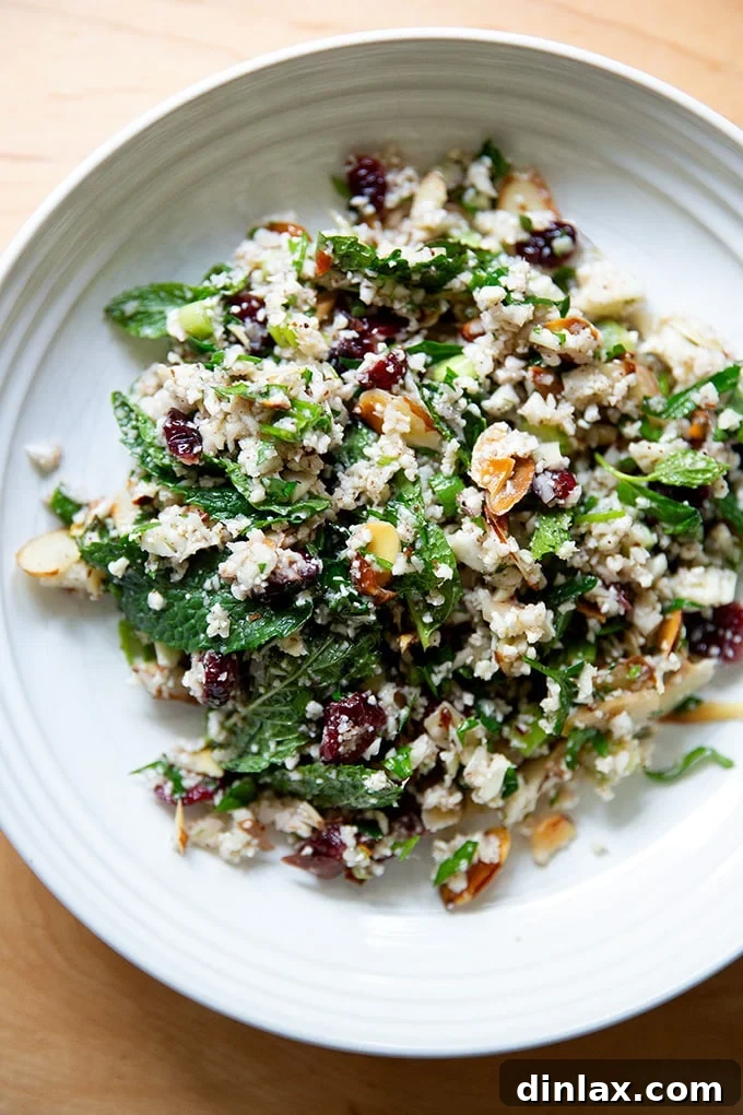 A close-up of the delicious cauliflower couscous salad in a rustic bowl.
