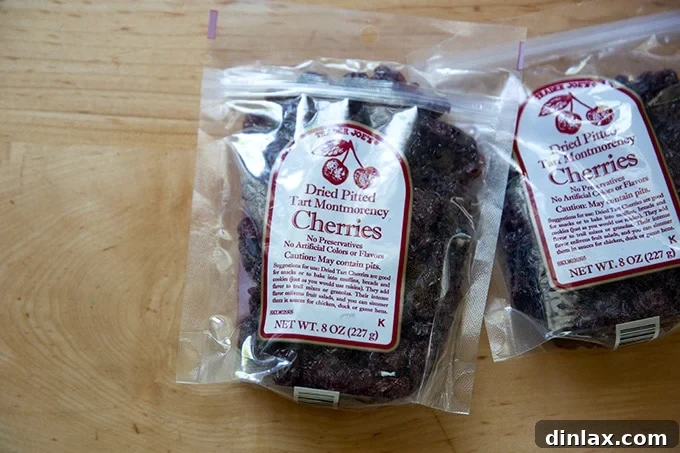 Two bags of dried tart cherries, highlighting the key ingredient for the salad.