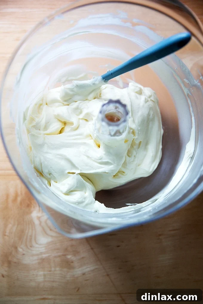 Light and Fluffy Cream Cheese Frosting 2 Beaten whipped cream - cream cheese frosting in a stand mixer.
