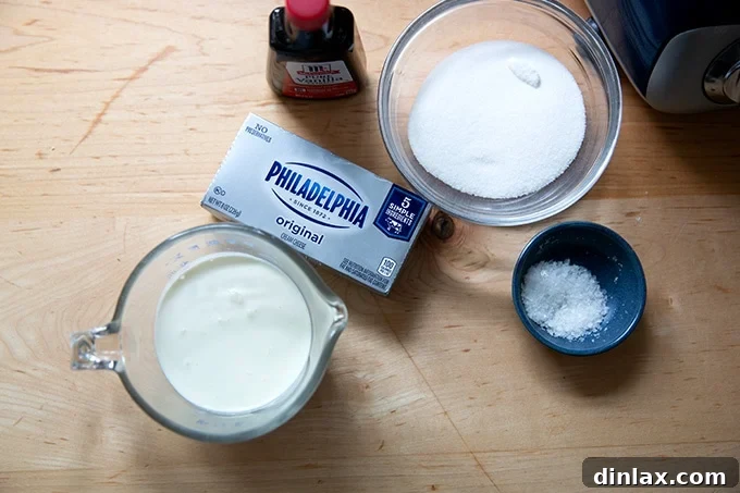 Light and Fluffy Cream Cheese Frosting 3 Ingredients to make whipped cream - cream cheese frosting on a countertop.