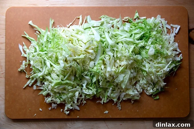 Five Ingredient Baked Cabbage Tortillas Gluten Free 4 Shredded cabbage on a cutting board.